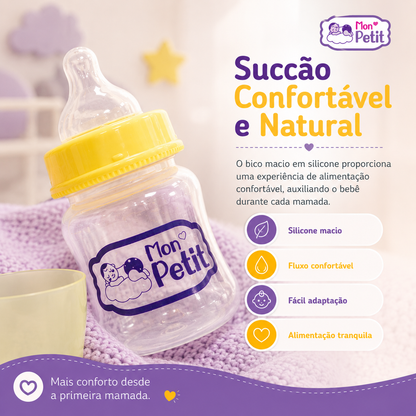 Biberão Mon Petit inclinado sobre uma manta lilás, promovendo uma sucção confortável e fluxo de leite natural para o bebé.