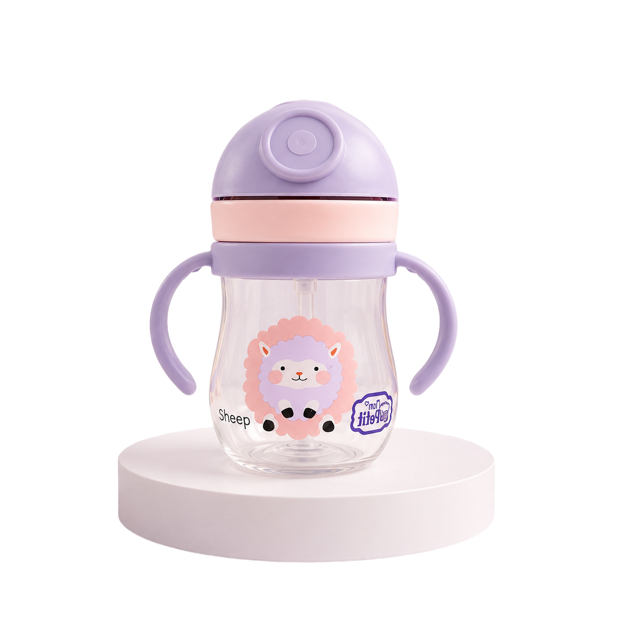Garrafa infantil de transição transparente com ilustração de uma ovelha lilás e cor-de-rosa, equipada com tampa protetora roxa, faixa rosa e alças ergonómicas, isolada sobre uma base branca.