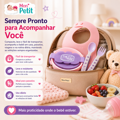 Tigela térmica com tampa e talheres de bebé arrumados no interior de uma mala de maternidade compacta, ideal para ilustrar a praticidade em viagens, passeios e rotinas fora de casa.