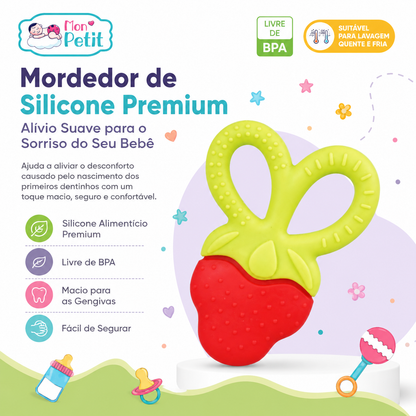 Infográfico publicitário do Mordedor de Silicone Premium Mon Petit em formato de morango, exibindo os selos de produto livre de BPA, adequado para lavagem quente e fria, material macio e fácil de segurar.